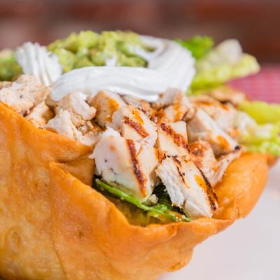 Grilled chicken tostada, closeup.