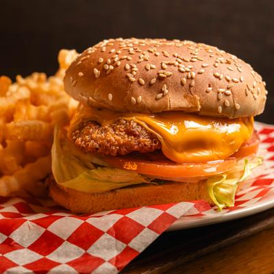 Crispy Chicken Burger and crinkle cut fries, close up.