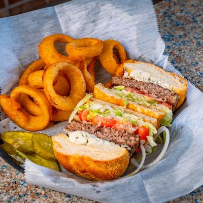 Black and blue burger and onion rings.