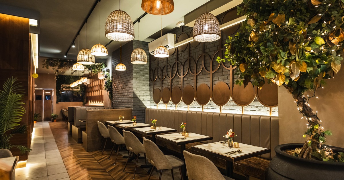 Brightly lit restaurant featuring rustic wooden floors and a lively ambiance