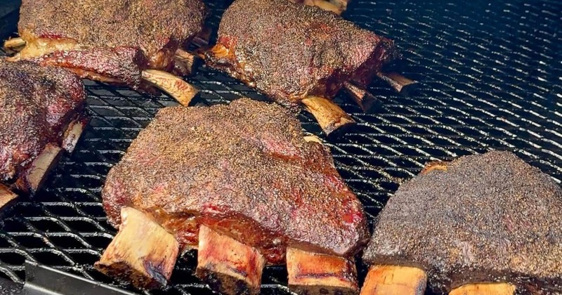 Dino ribs cooking in the smoker