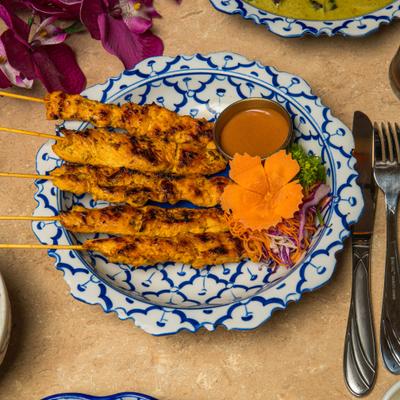 Chicken Satay with peanut sauce on the side.