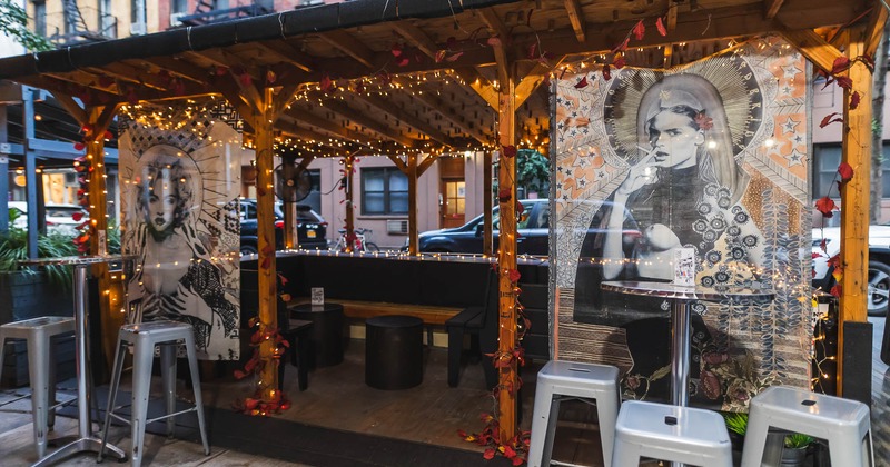 Exterior, high tables and chairs near covered patio