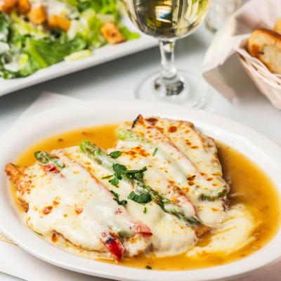 Lightly battered chicken, topped with asparagus and melted cheese, in lemon wine sauce.