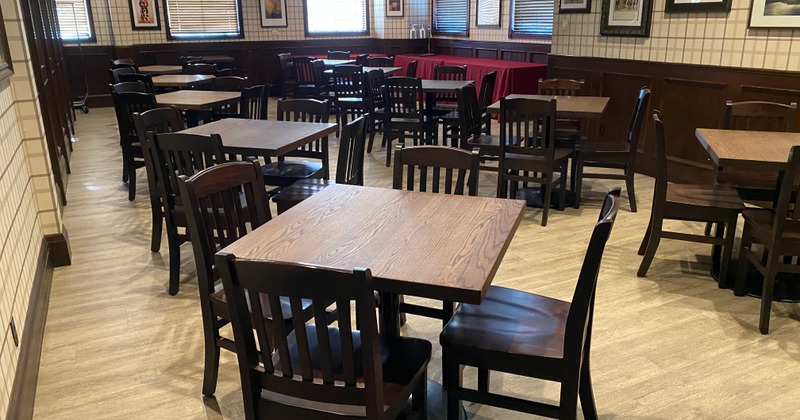 Dining area with wooden tables and chairs