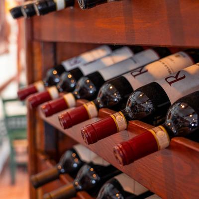 Wine bottles on a wooden rack.