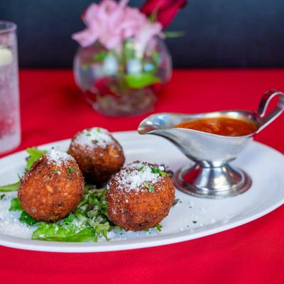 Arancini with marinara sauce.