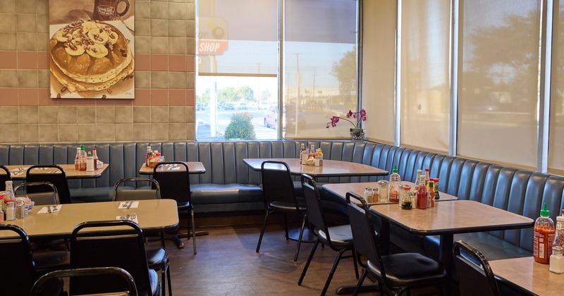 Interior space, dining area with tables ready for guests