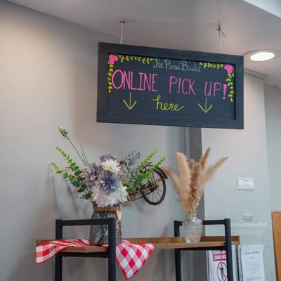Interior with a sign indicating an online pickup area.