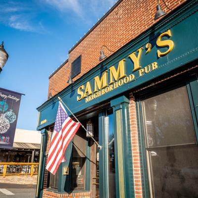 Sammy's Pub exterior, entrance with the US flag