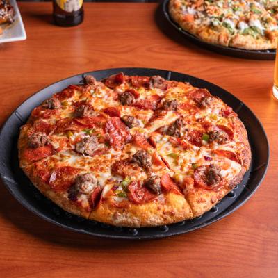 Atlas Combo Pizza topped with pepperoni and Italian sausage.