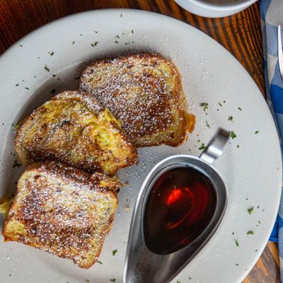 Cinnamon Raisin French Toast, served with syrup dressing