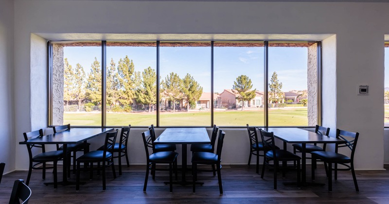 Interior, tables and chairs, by the restaurant window