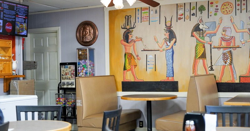 Interior, seating area, tables and chairs, booth area in the back