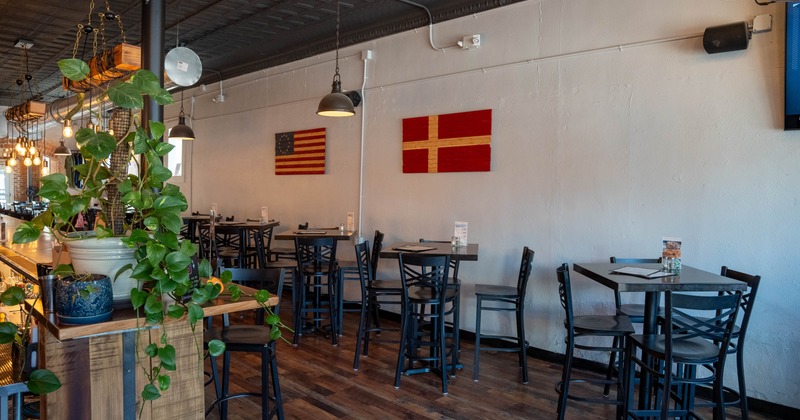 Interior, tables and chairs all lined up, ready for guests
