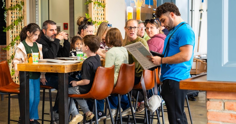 Guests being served by the staff