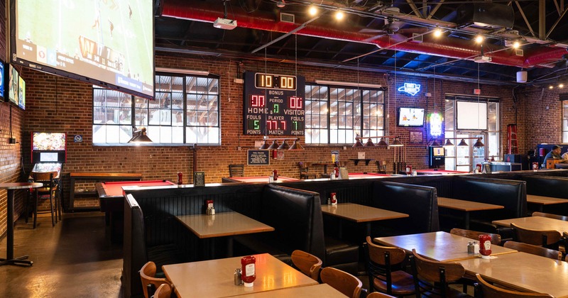 Inside, booths, tables, chairs, score board