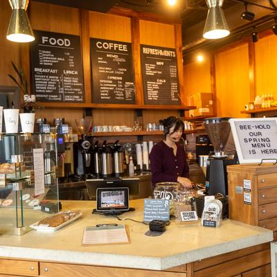 Interior, a staff member behind the front counter