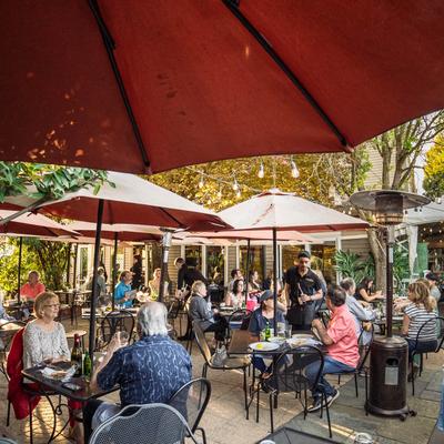 Many guests at the outdoor patio.