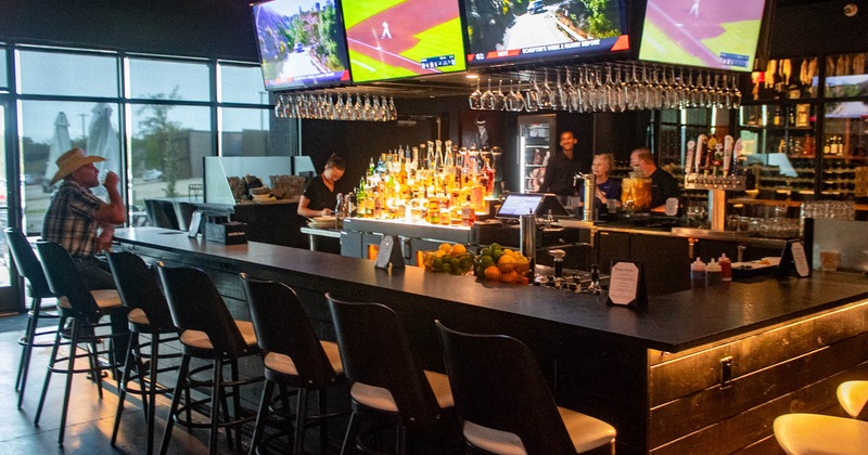 Bar area and TVs above the bar