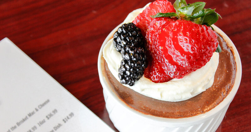 Creme brulee with strawberries, blackberries and cream