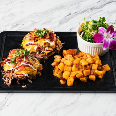 The Benedicts, country potatoes, and salad.