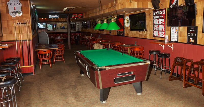 Interior, seating area, pool table, TV on the wall