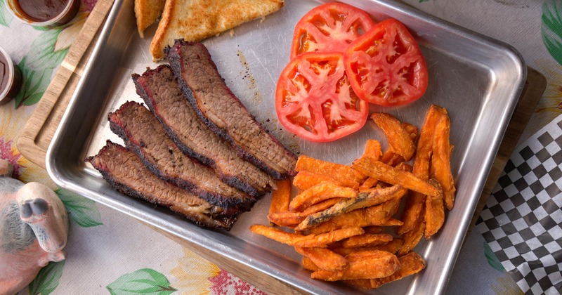 Smoked Beef Brisket Plate with tomato slices, fries, and toast