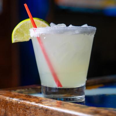 Margarita cocktail, served in a glass, front view.