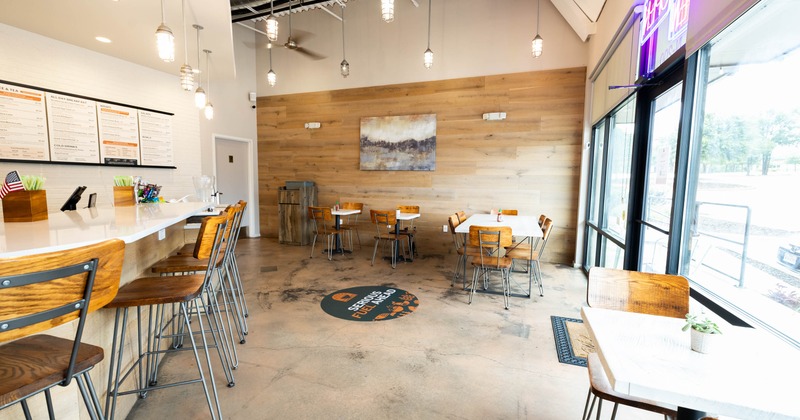 Interior seating area with wooden chairs and tables