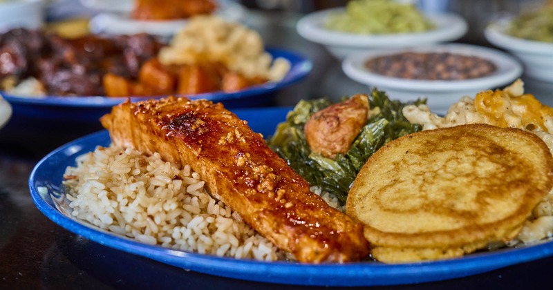 Marinated salmon plate with other dishes in the background