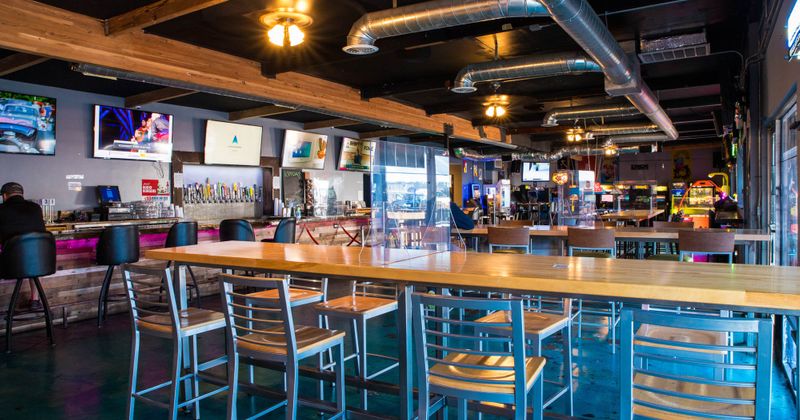 The interior of the restaurant, game machines, a few guests