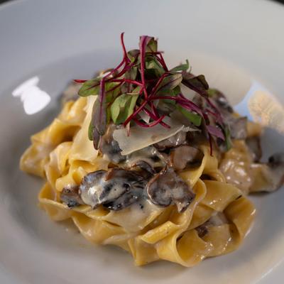 Pappardelle pasta with creamy mushroom sauce.