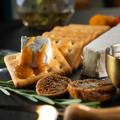 Brie cheese with crackers and figs.