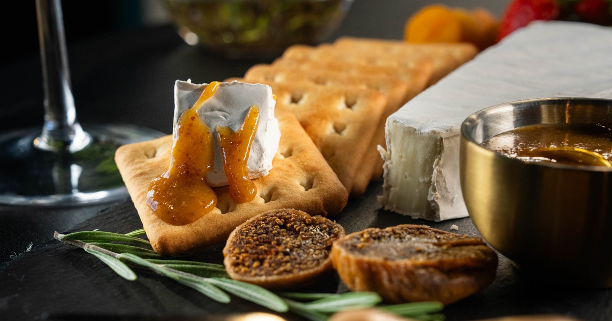 Brie cheese with crackers and dried figs