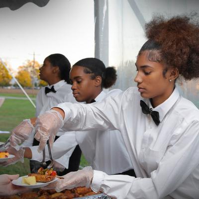 Staff serving food to guests
