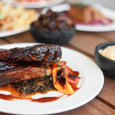 BBQ ribs, with homemade gouda grits, and braised collard greens