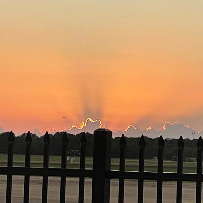 Vibrant sunset sky over the airport.
