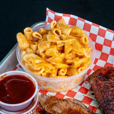 Mac and cheese served as a side dish on a BBQ plater.