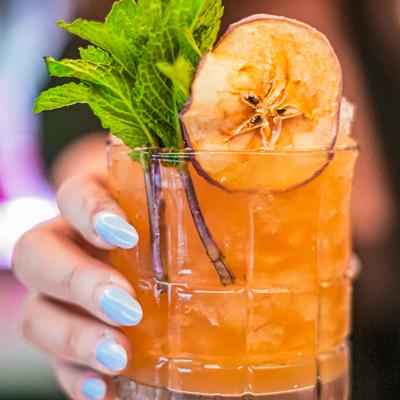 Staff member serving cocktail