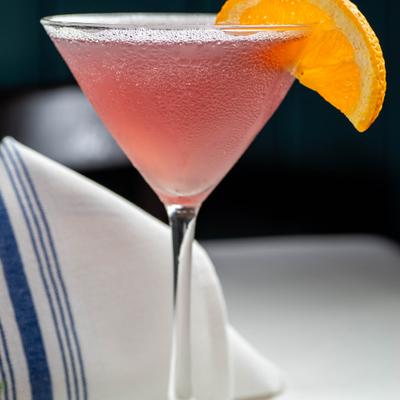 French Martini  garnished with an orange slice.