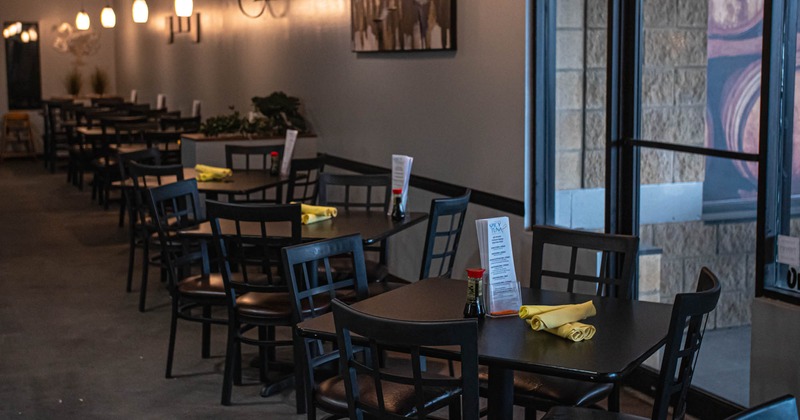 Interior of a restaurant, tables, chairs and pendant lights