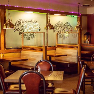 Interior, booths, tables and chairs waiting for guests