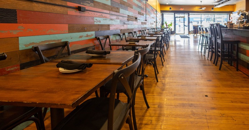 Interior of a rustic restaurant with colored wooden walls