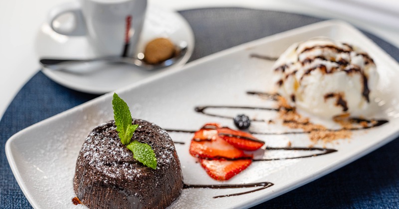 Lava cake served with ice cream and berries