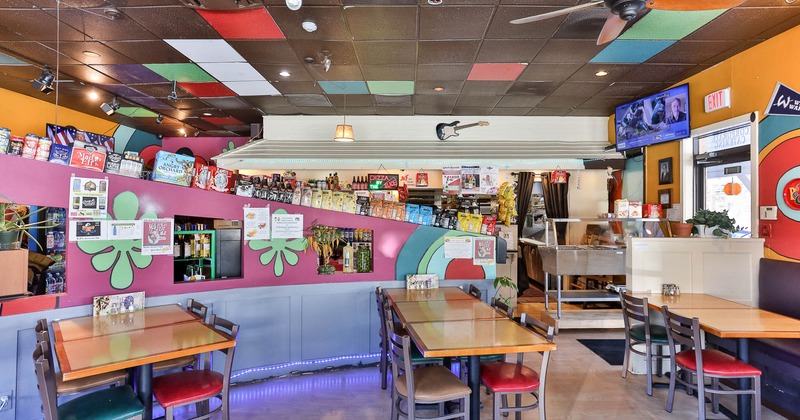 Interior, seating area with the bar in the back