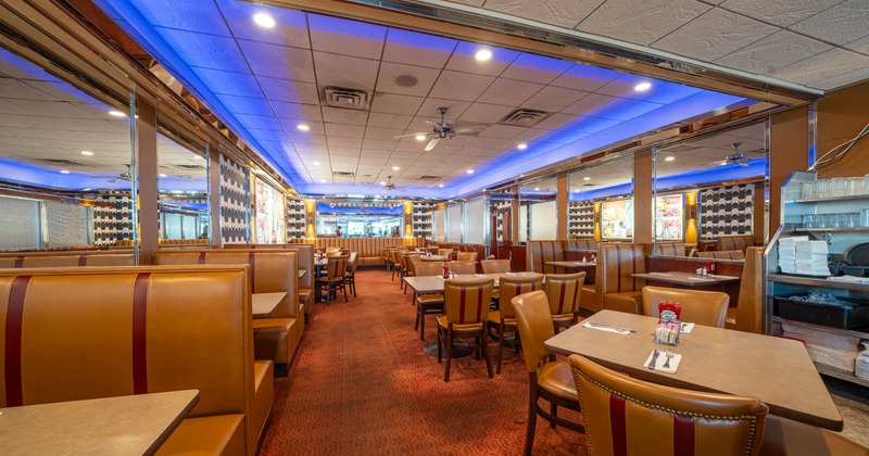 Interior, wide view, tables, chairs and seating booths