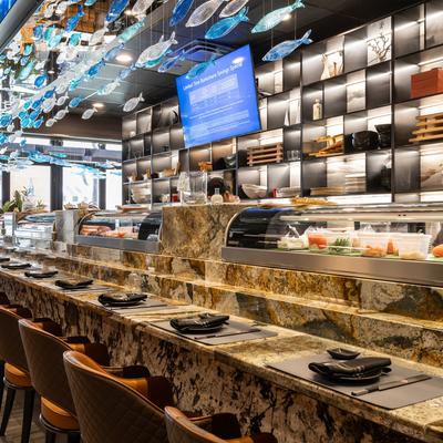 Sushi bar with a counter set for dining.