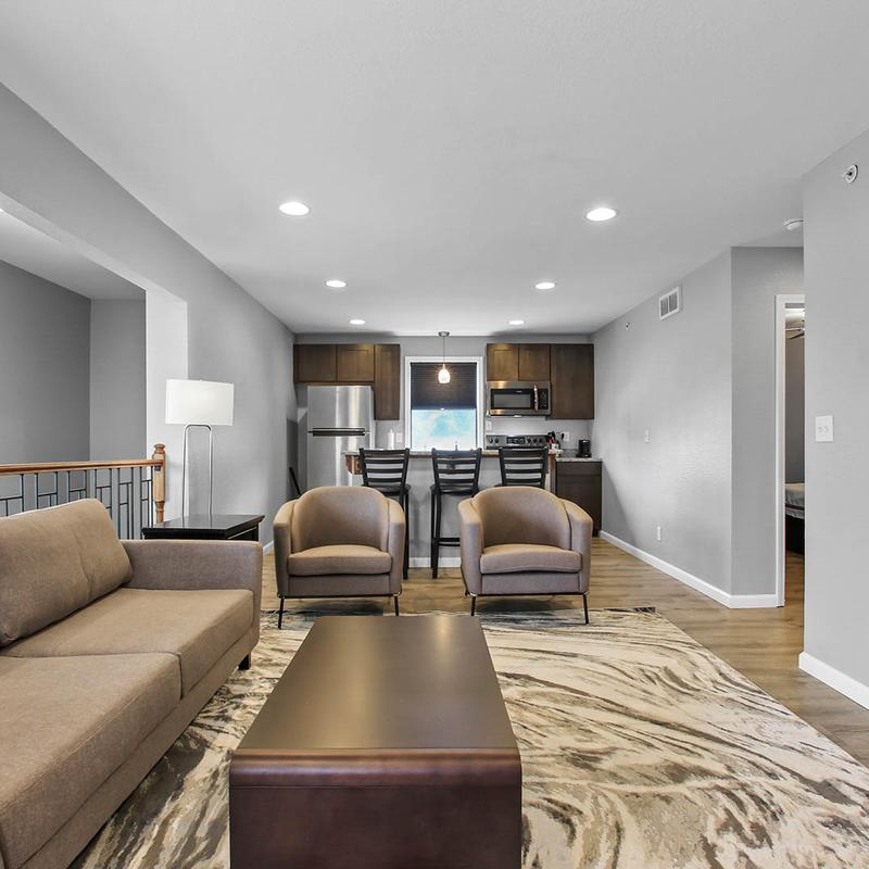 A sofa, armchairs, and a coffee table.