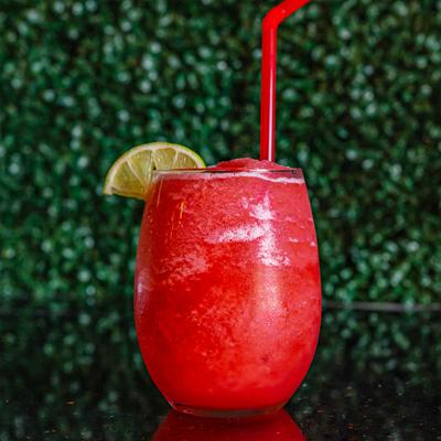 Frozen Strawberry Margarita, garnished with lime wedge.